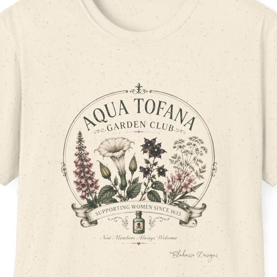 An off-white short-sleeve crewneck t-shirt featuring a vintage-style botanical graphic on the chest with the text 'AQUA TOFANA GARDEN CLUB' and illustrations of plants.