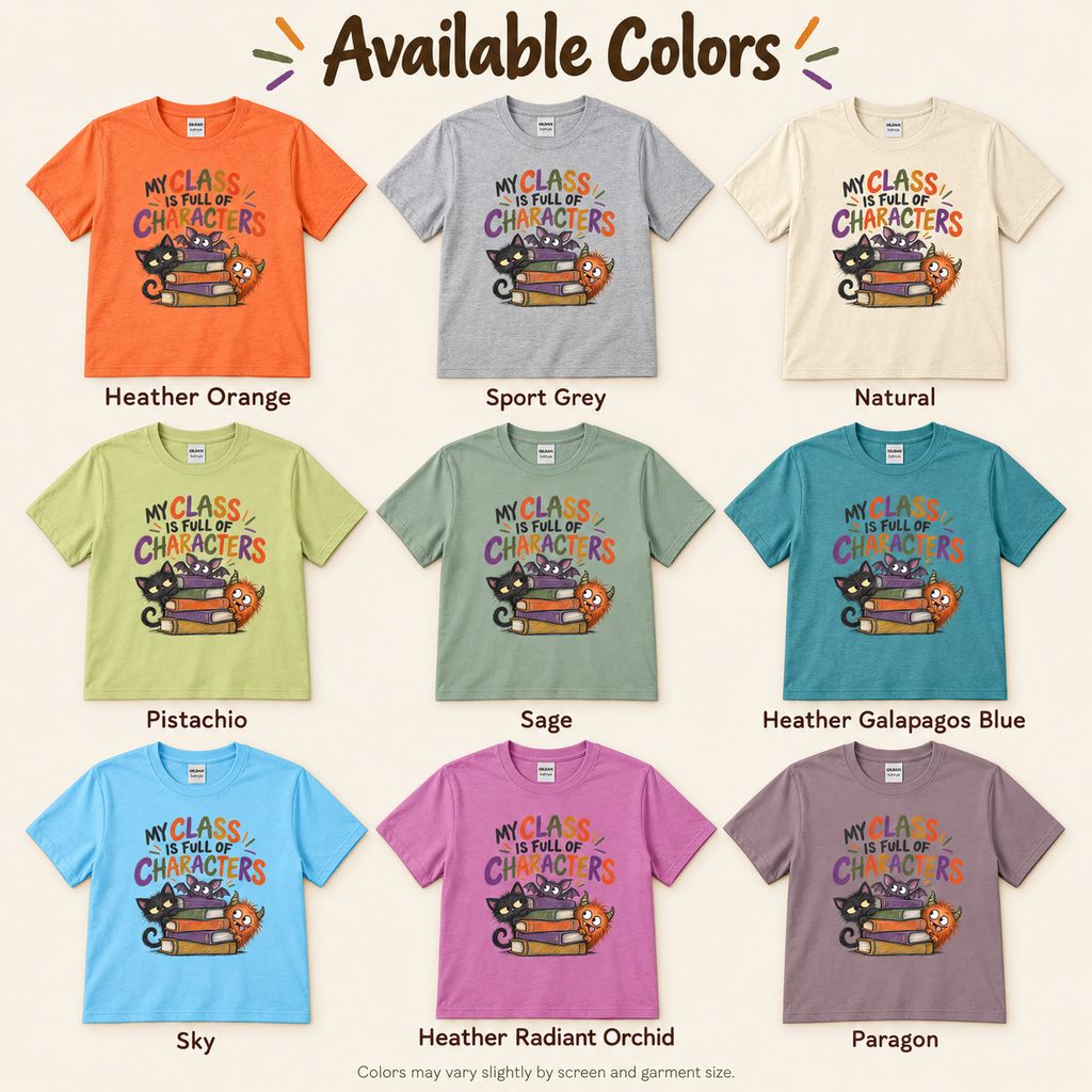 An available colors chart showing nine short-sleeve graphic T-shirts in different colors, labeled with names like Heather Orange, Sport Grey, Natural, Pistachio, Sage, Heather Galapagos Blue, Sky, Heather Radiant Orchid, and Paragon. The shirts all have a cartoon cat and book graphic on the front, and the heading reads 'Available Colors'.
