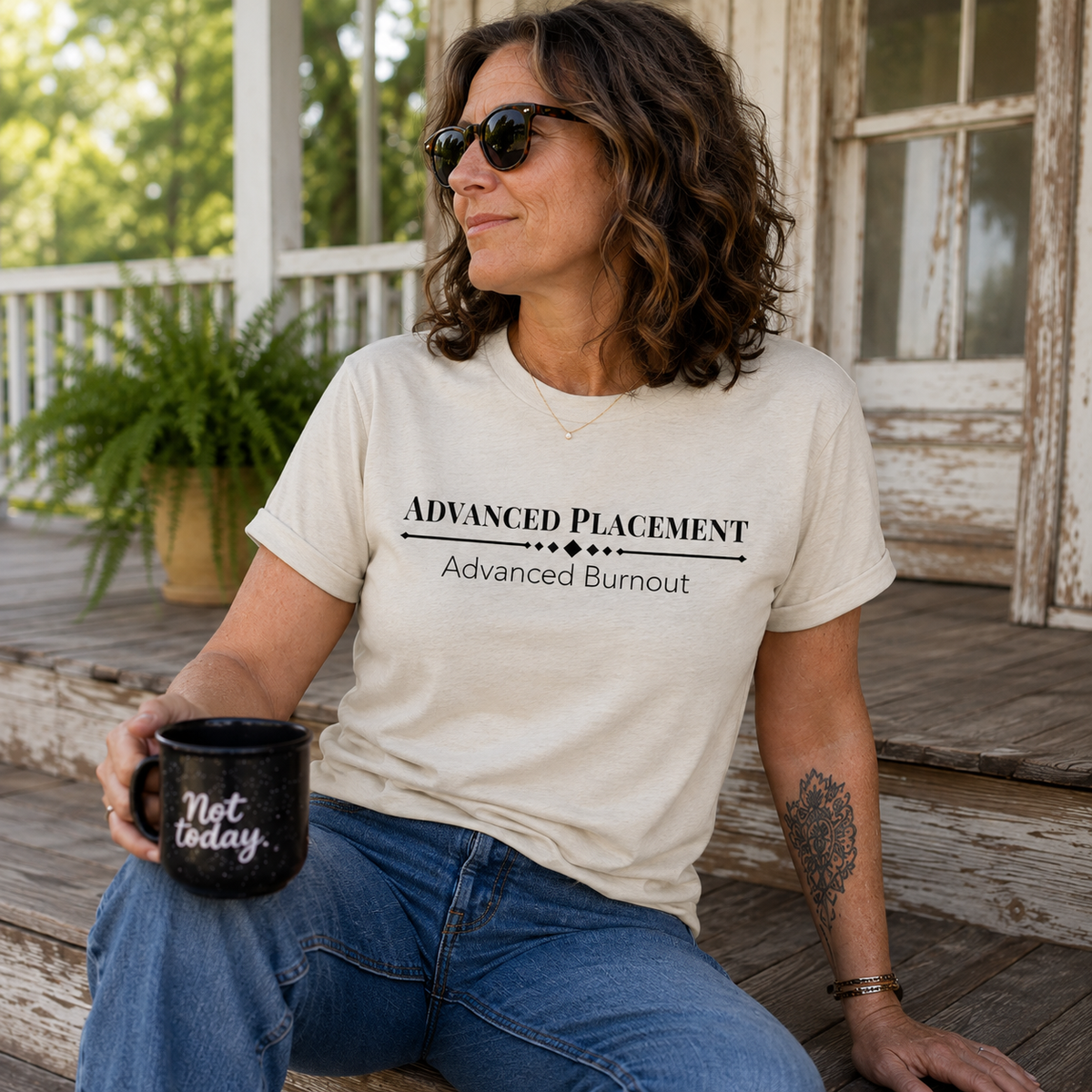Woman wearing a Natural Advanced Placement Advanced Burnout shirt while relaxing on a porch.