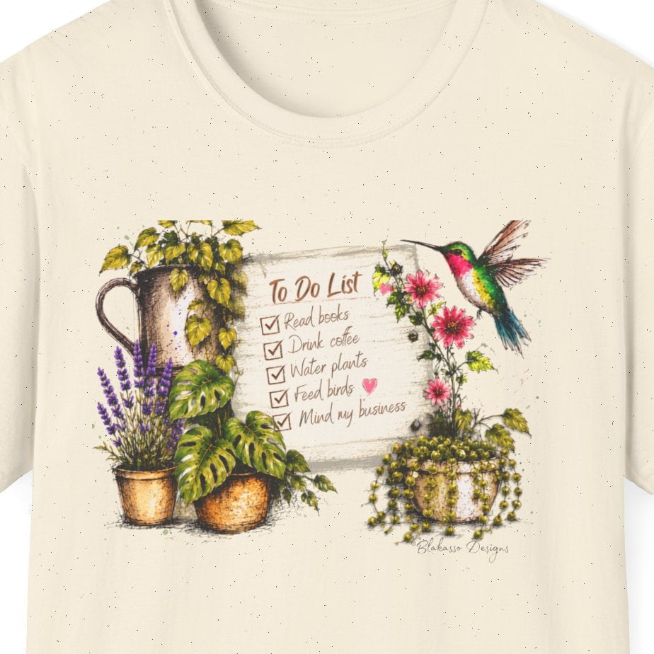Close up of Cozy Garden To Do List shirt design with books coffee plants birds and hummingbird