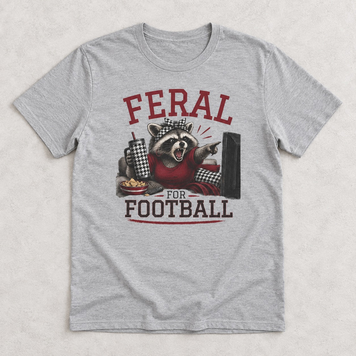 Feral for Alabama funny football shirt shown in a styled flat lay