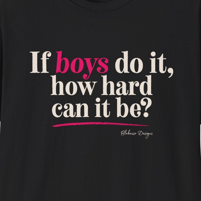 Close up of black If Boys Do It How Hard Can It Be T shirt with ivory lettering and bright pink accent