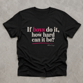 Black If Boys Do It How Hard Can It Be T shirt shown in a clean flat lay with ivory and bright pink lettering