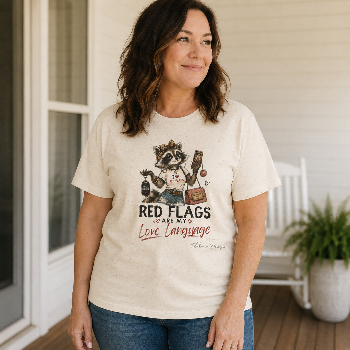 Woman wearing Red Flags Are My Love Language Brandi K. Raccoon Council graphic tee