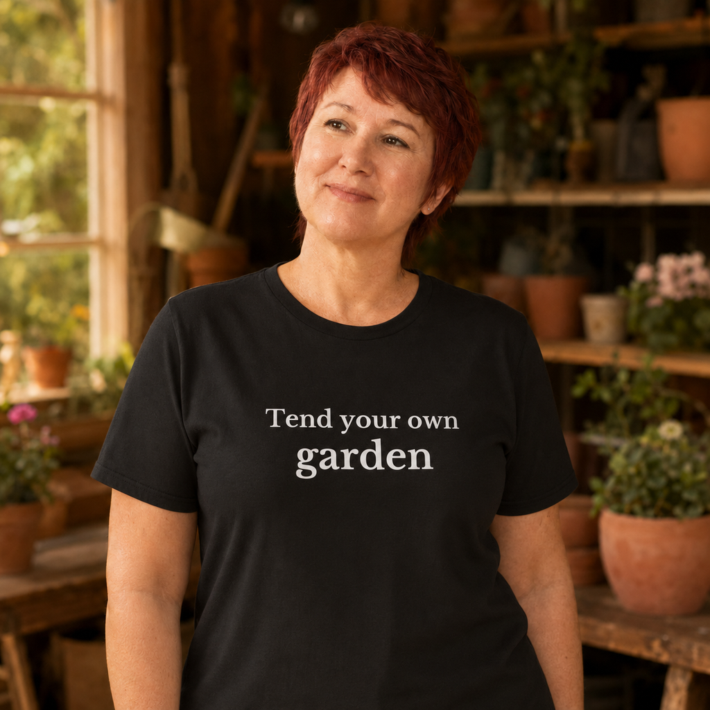 Woman wearing Tend Your Own Garden minimalist boundary graphic tee