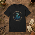 You Strange as Angels ocean angel unisex graphic tee flat lay