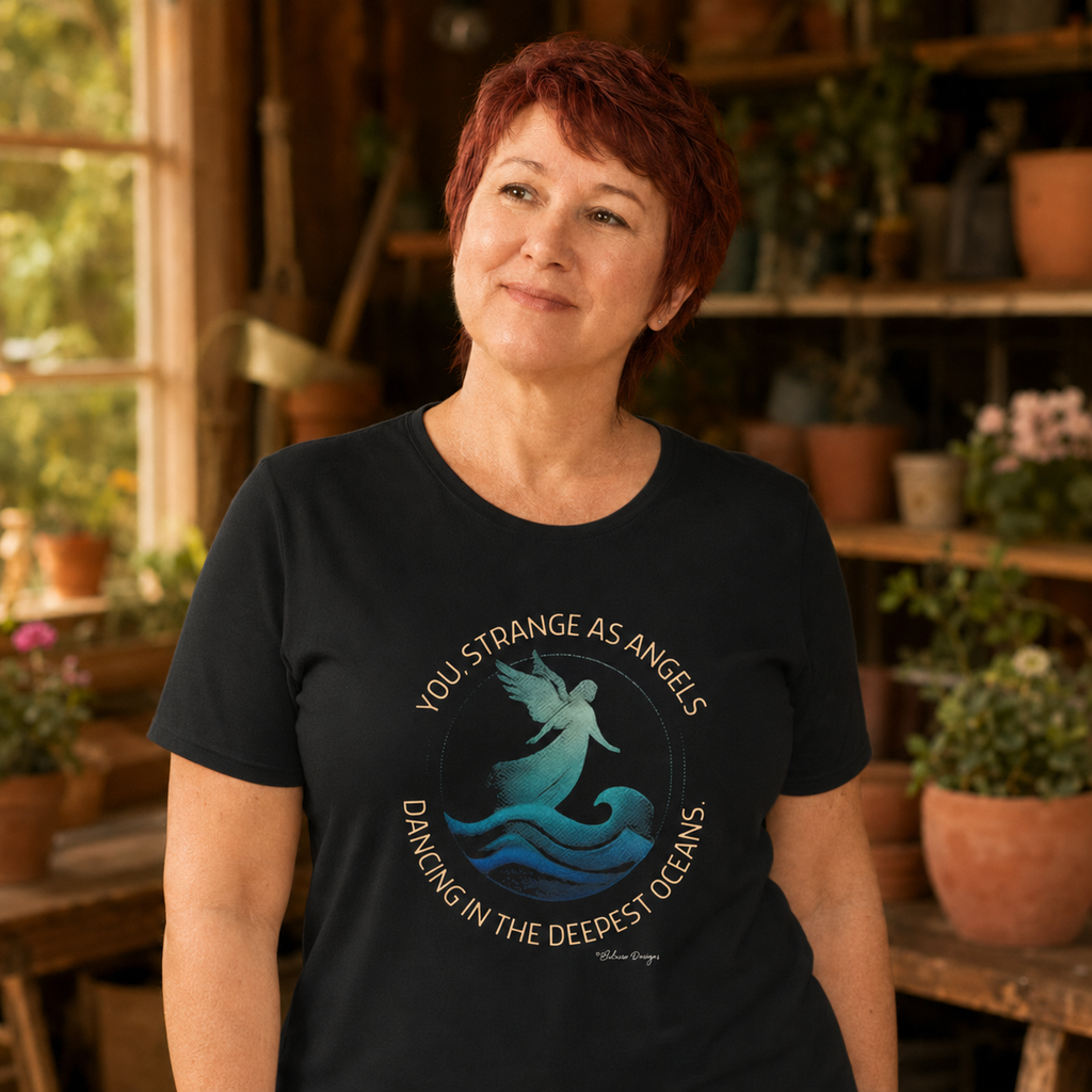 Woman wearing You Strange as Angels ocean angel graphic tee