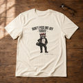 Women's Gildan Softstyle graphic tee featuring Maddelynn the raccoon wearing an "I Bloom Out of Spite" shirt beneath the phrase "Don't Piss Me Off Today."