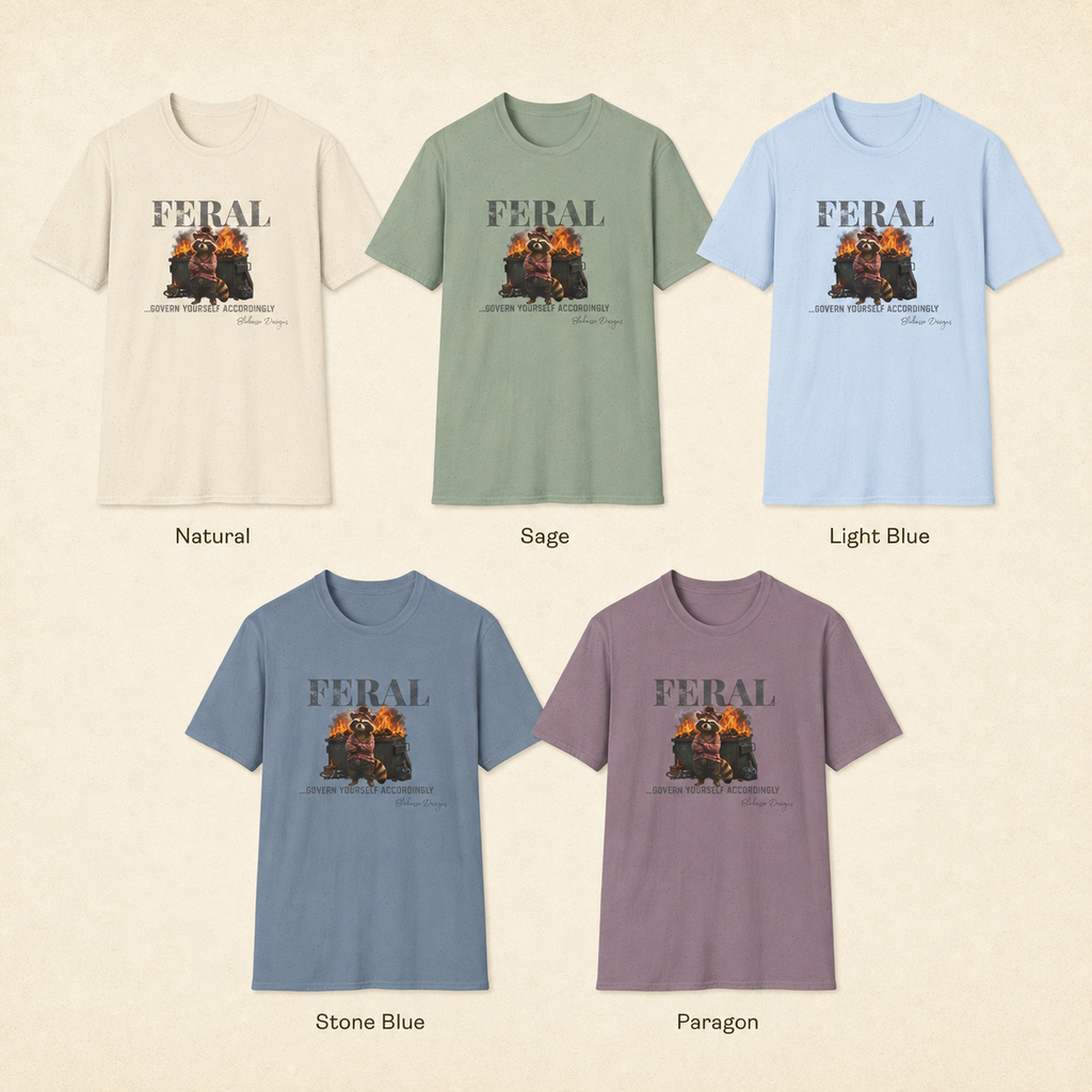 Available shirt colors for the “Feral...Govern Yourself Accordingly” raccoon graphic tee by Blakasso Designs.