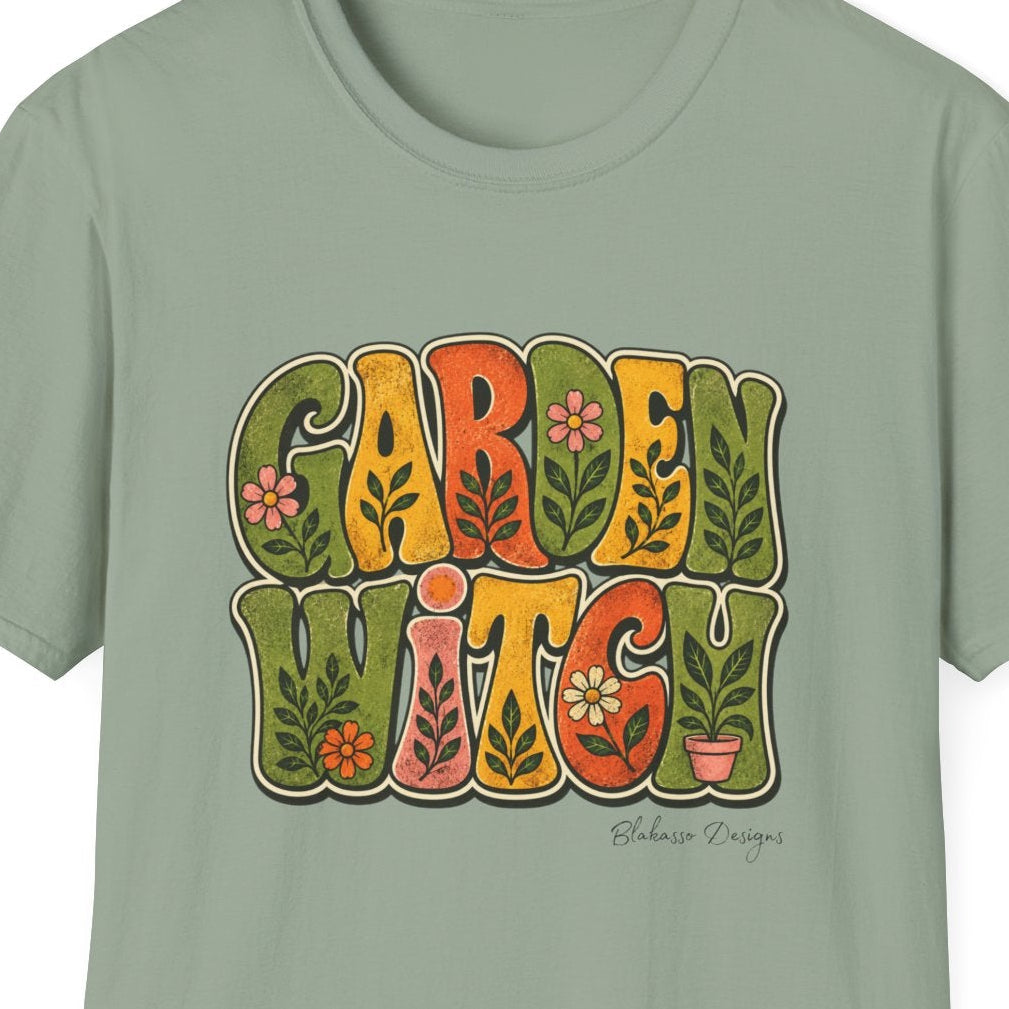 Close-up of the Garden Witch design showing distressed retro lettering, flowers, leafy botanical details, and warm earthy colors.