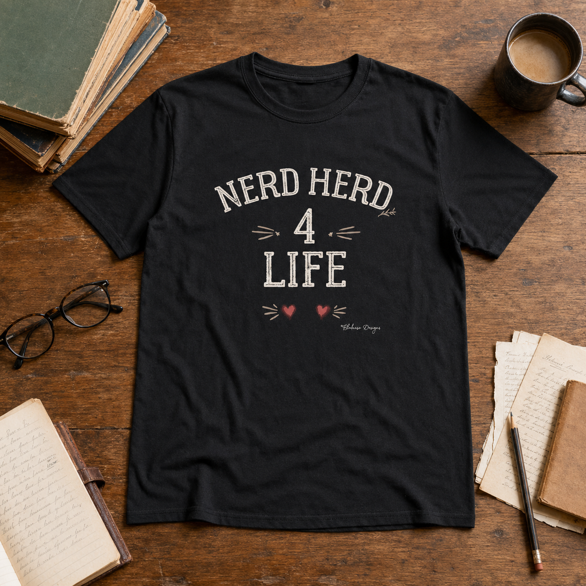 Black Nerd Herd 4 Life typography graphic tee with distressed vintage lettering and hand drawn heart details.