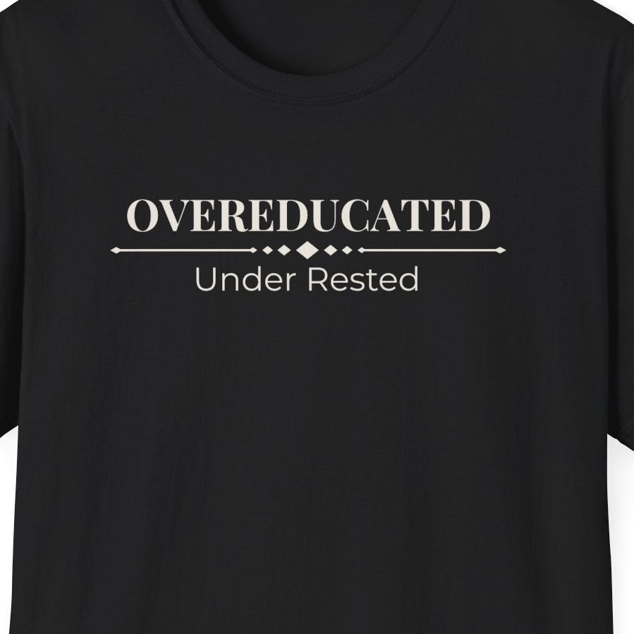 Close view of the Overeducated Under Rested design printed across the front of the shirt.