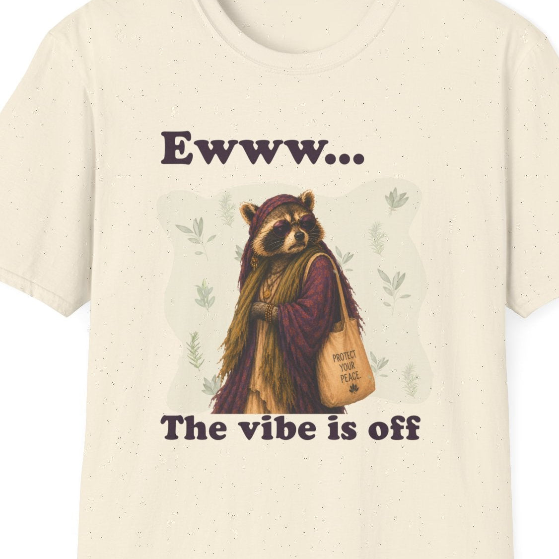 Close up of Diana the raccoon wearing sunglasses and a flowing scarf while carrying a Protect Your Peace tote in The Vibe Is Off design.
