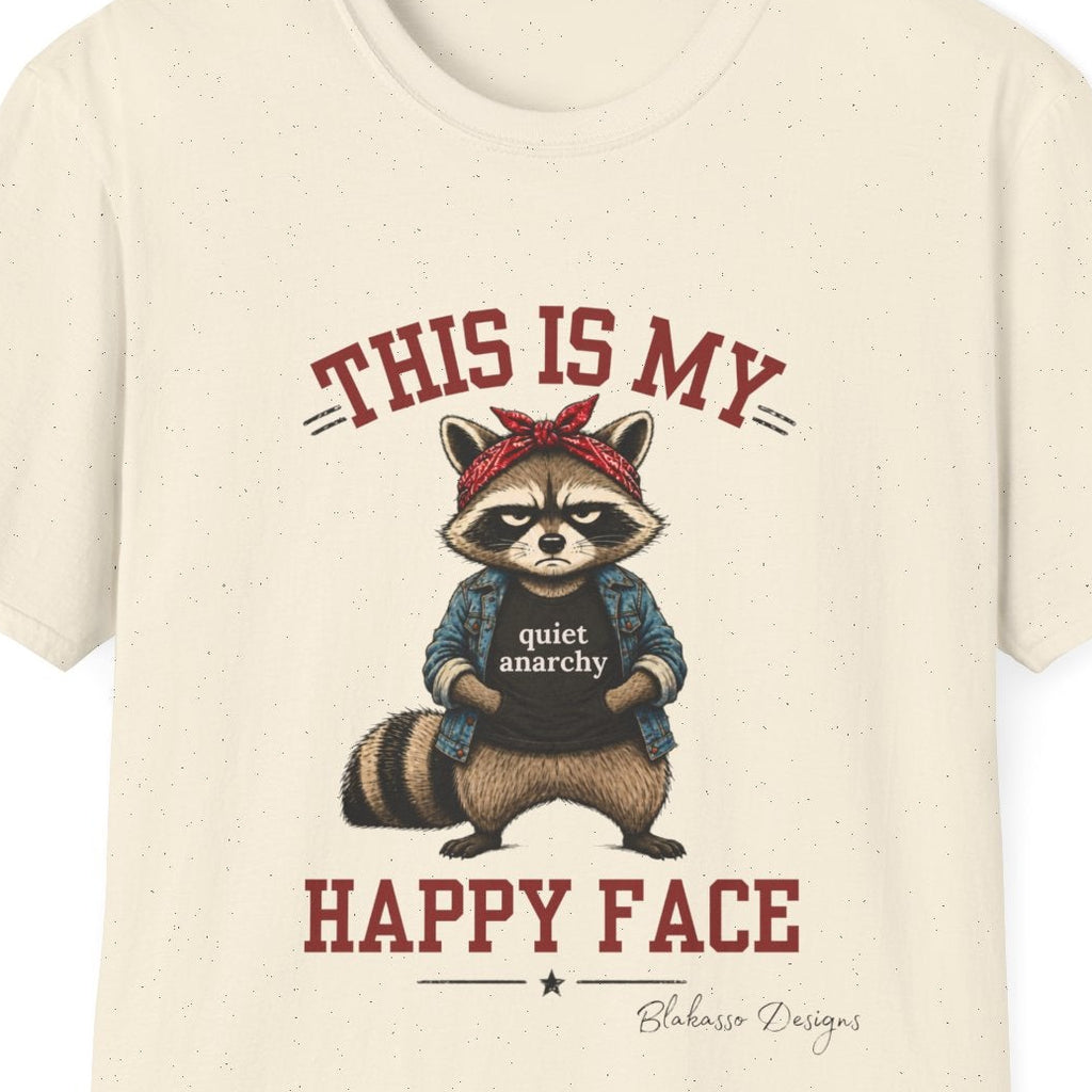Close up of the “This Is My Happy Face” design featuring an unimpressed raccoon wearing a red bandana, denim jacket, and Quiet Anarchy shirt.