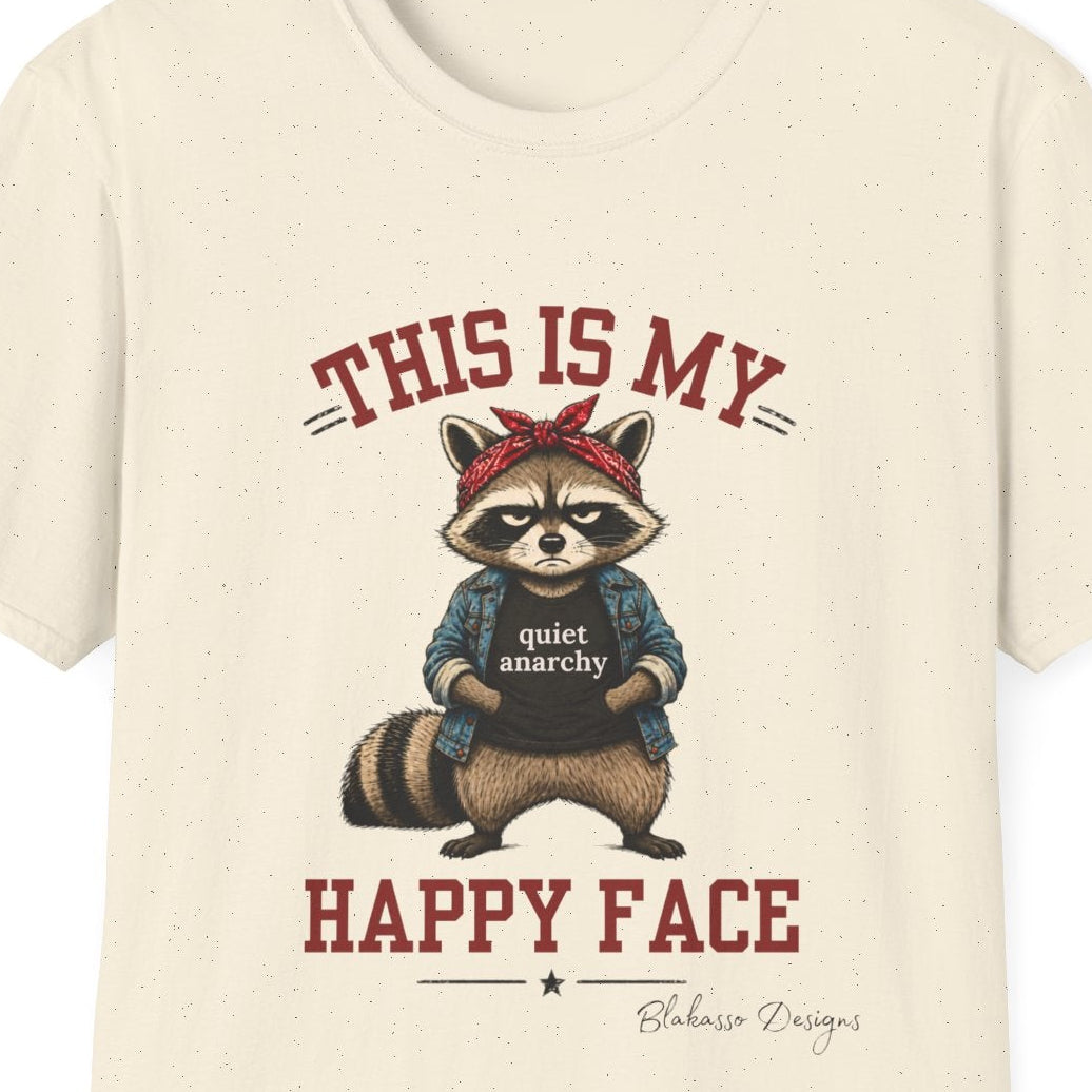 Close up of the “This Is My Happy Face” design featuring an unimpressed raccoon wearing a red bandana, denim jacket, and Quiet Anarchy shirt.