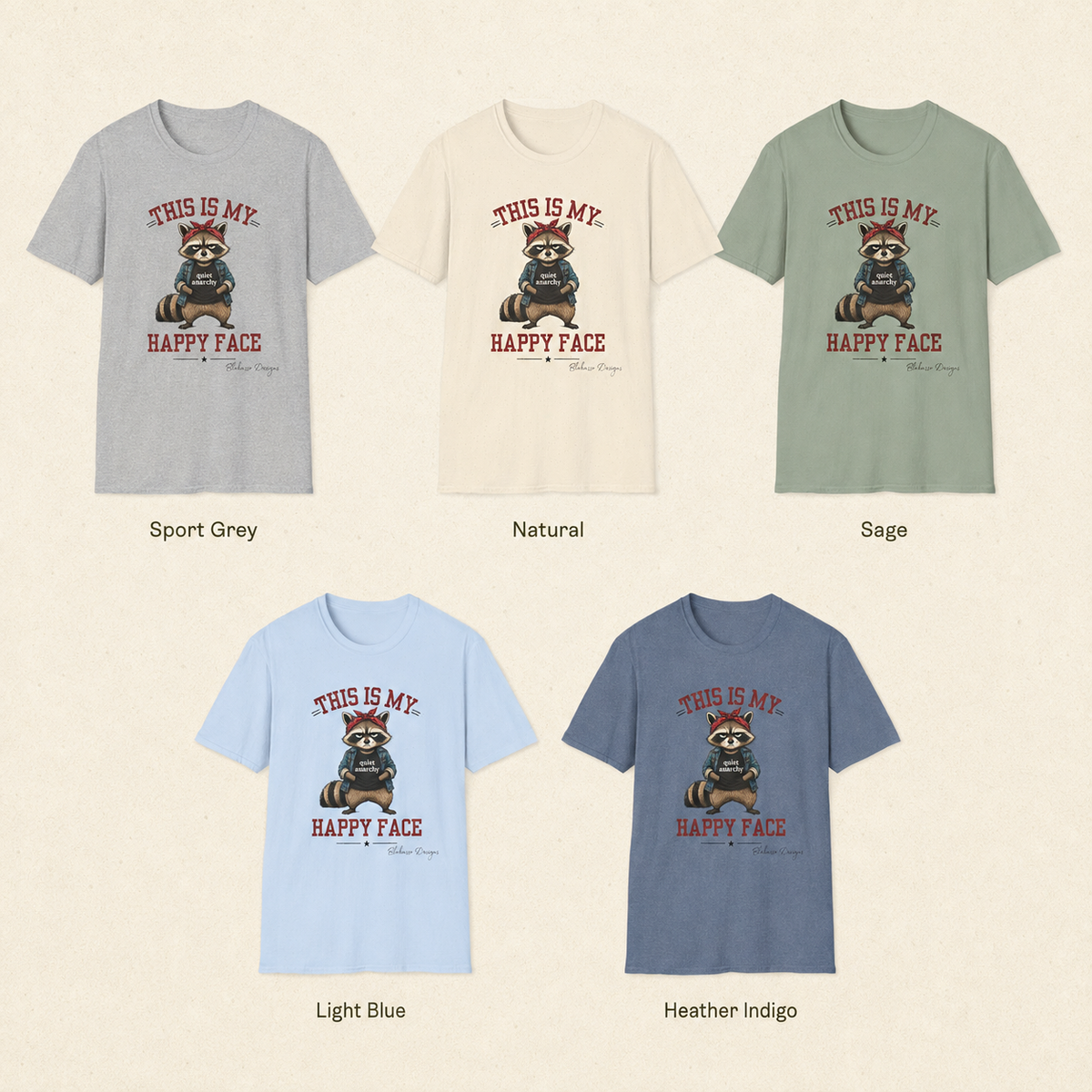 Available shirt colors for the “This Is My Happy Face” raccoon graphic tee by Blakasso Designs.