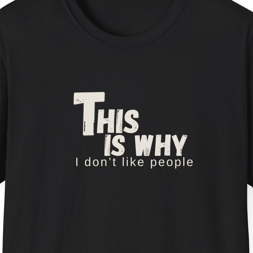 Close up of the distressed typography reading "This Is Why I Don't Like People" on a black graphic tee.