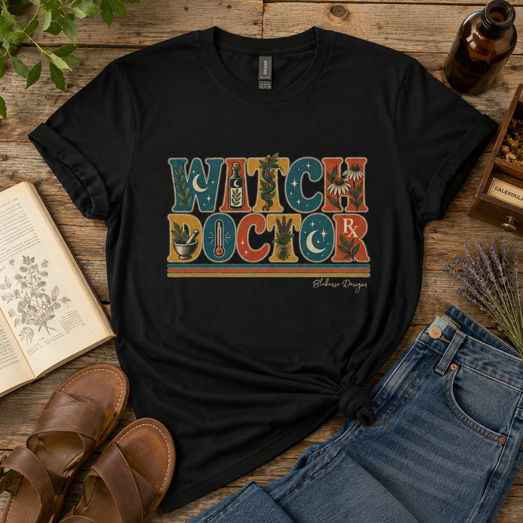 Black crew neck T-shirt featuring the retro Witch Doctor design with botanical, apothecary, celestial and vintage medical details.