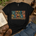 Black crew neck T-shirt featuring the retro Witch Doctor design with botanical, apothecary, celestial and vintage medical details.
